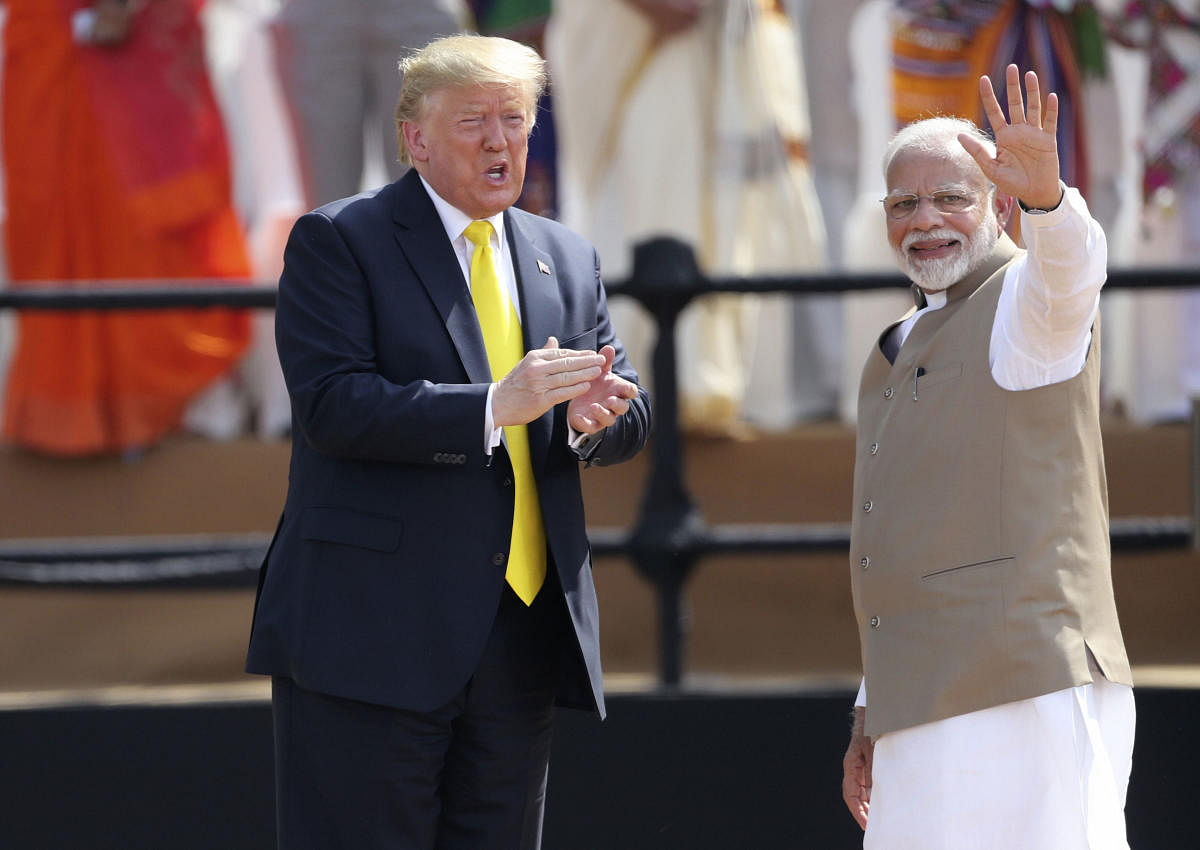  Indian Prime Minister Narendra Modi, right, waves as U.S. President Donald Trump reacts to the crowd during the 'Namaste Trump' event at Sardar Patel Stadium in Ahmedabad, India, Monday, Feb. 24, 2020. Credit: AP Photo
