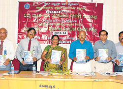 District credit plan for Chamarajanagar was released by deputy commissioner M V Savithri, recently. K Lakshmisha is also seen. DH PHOTO