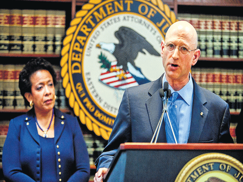 barging in: US Attorney General Loretta Lynch and Richard Weber of the IRS during a news conference on the US government's crackdown on some of the world's most influential football officials. (Inset: Chuck Blazer) nyt