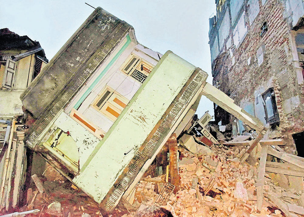 A building that collapsed after heavy rain in Ahmedabad on Friday. PTI
