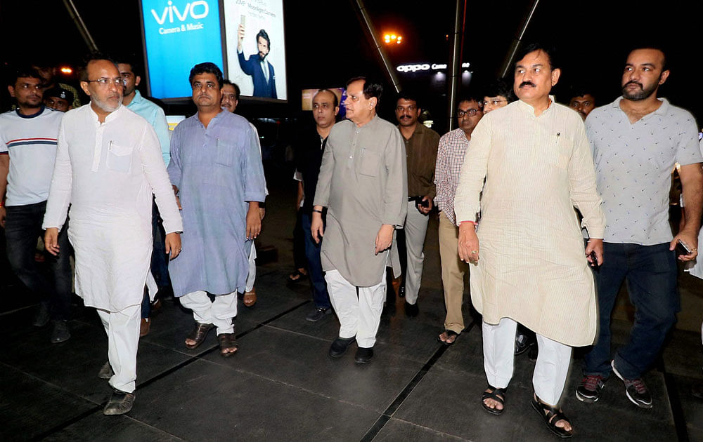 Ahmed Patel (C), said that he is confident of victory in the polls. PTI photo.