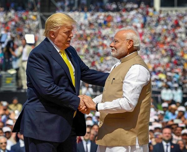 Prime Minister Narendra Modi shakes hands with US President Donald Trump during the 'Namaste Trump' event at Sardar Patel Stadium in Ahmedabad, Monday, Feb. 24, 2020. (PTI Photo)