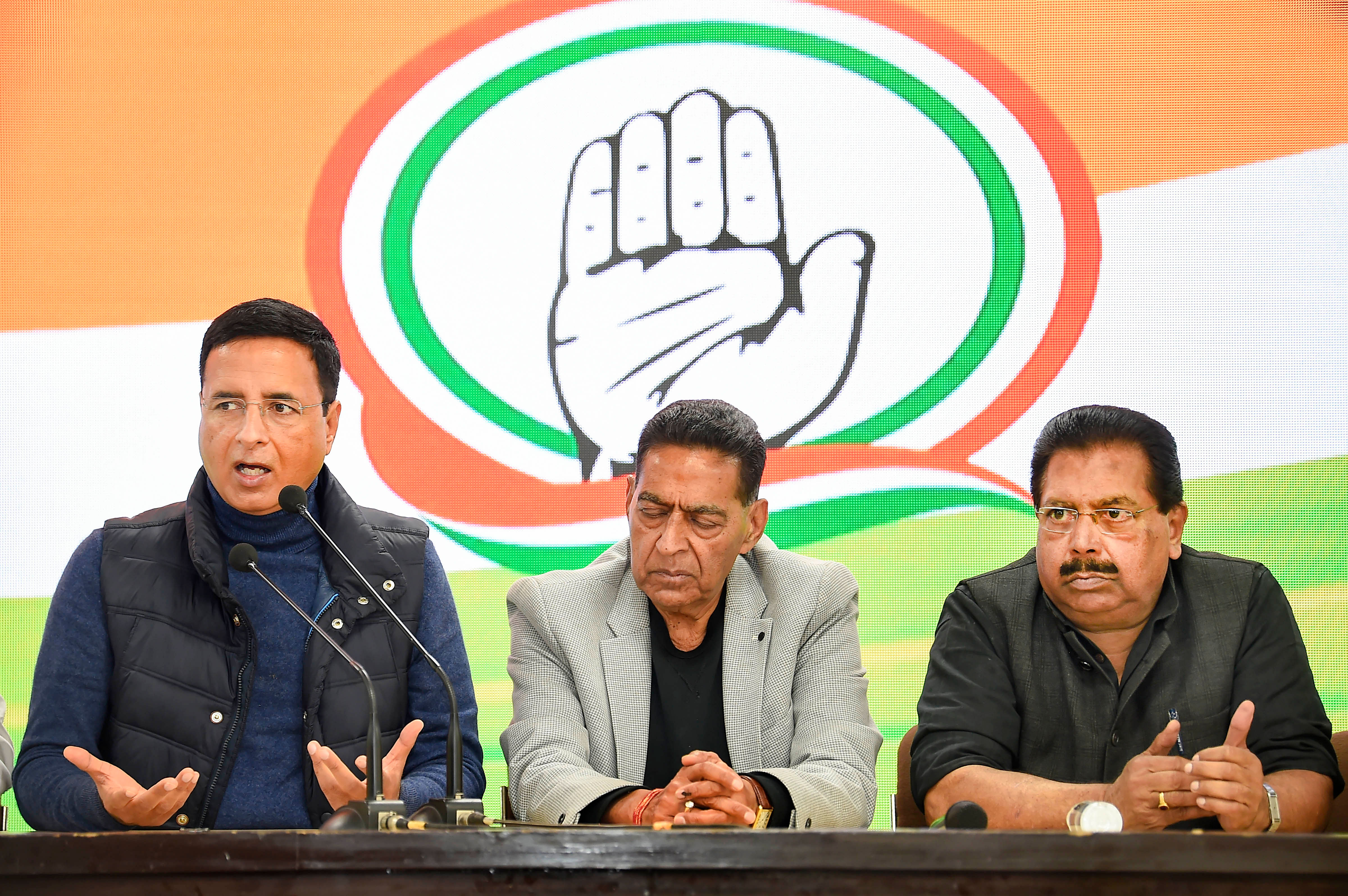 Congress spokesperson Randeep Singh Surjewala (L) addresses a press conference during the counting of votes for Delhi Assembly polls, in New Delhi, Tuesday, Feb. 11, 2020. Delhi Congress Chief Subhash Chopra (C) and Delhi Congress in-charge PC Chacko (R). (PTI Photo)