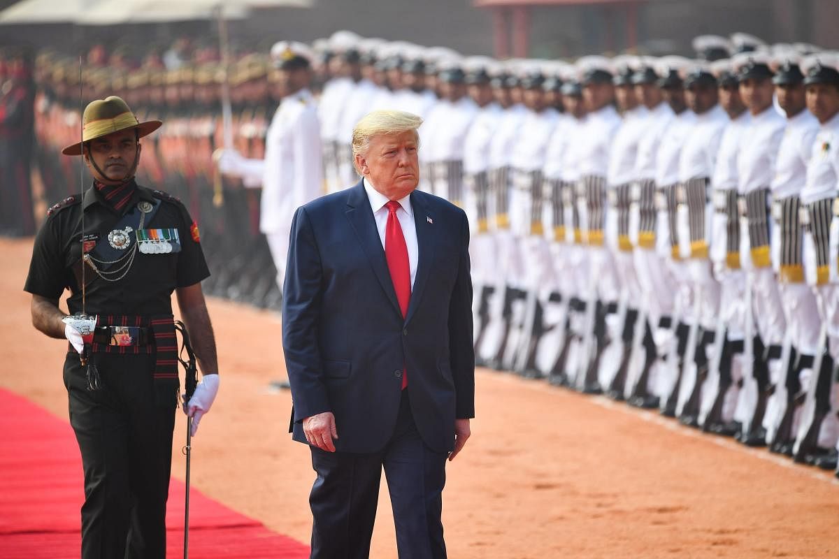 U.S. President Donald Trump inspects honour guards during the ceremonial reception at the forecourt of Rashtrapati Bhavan in New Delhi. (Reuters photo)