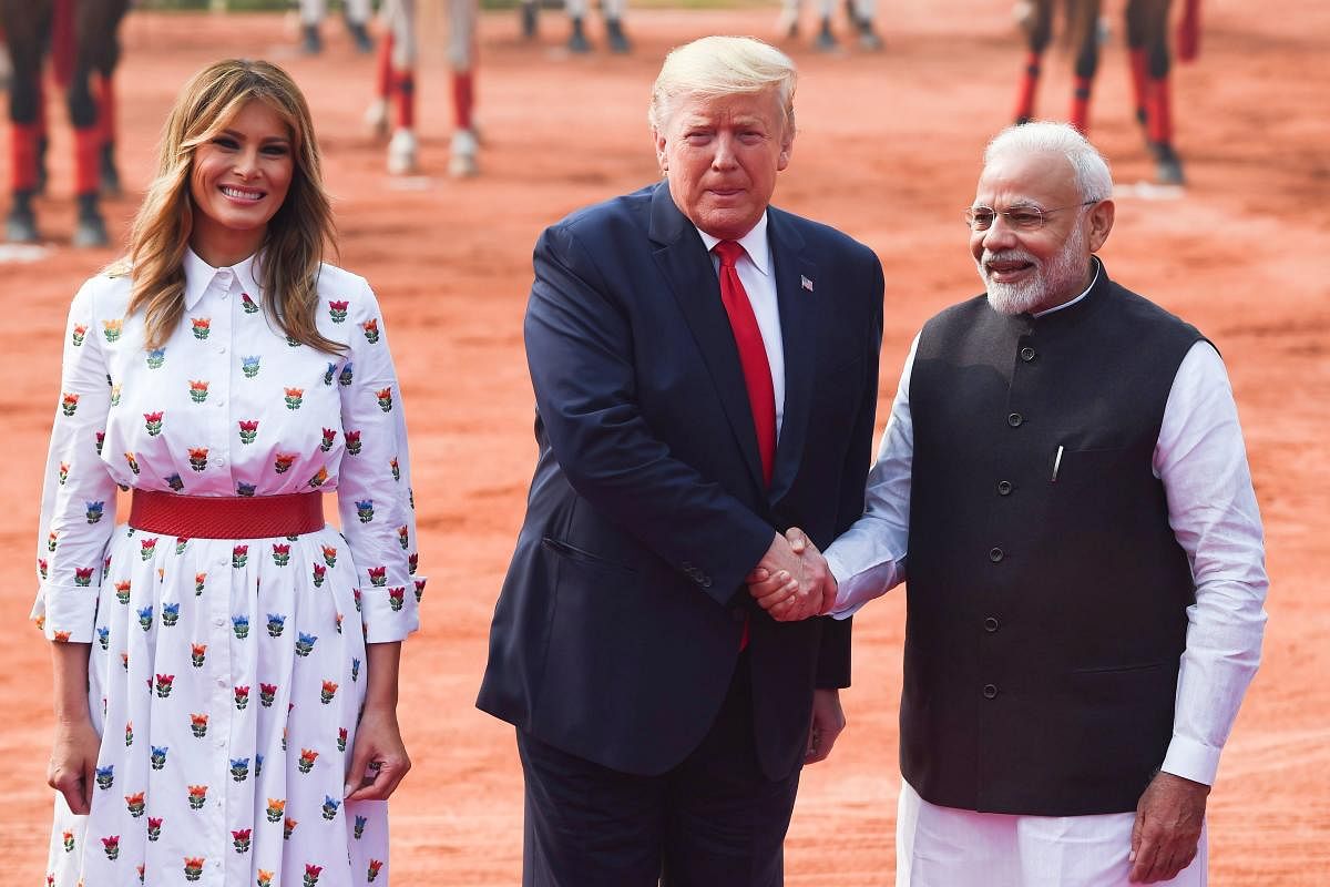 Prime Minister Narendra Modi (R) greets US President Donald Trump and First Lady Melania Trump during a ceremonial reception at Rashtrapati Bhavan. AFP