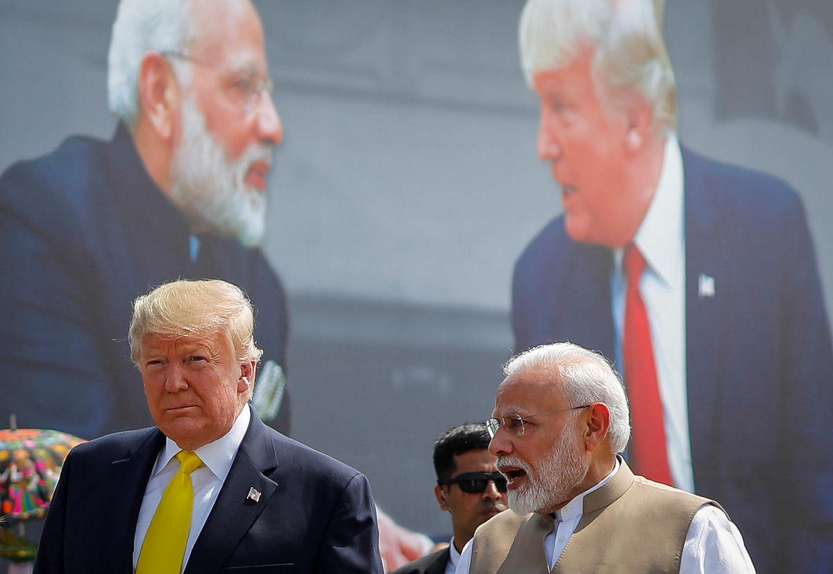US President Donald Trump and Indian Prime Minister Narendra Modi speak during the welcoming ceremony, as Trump arrives at Sardar Vallabhbhai Patel International Airport in Ahmedabad. Reuters