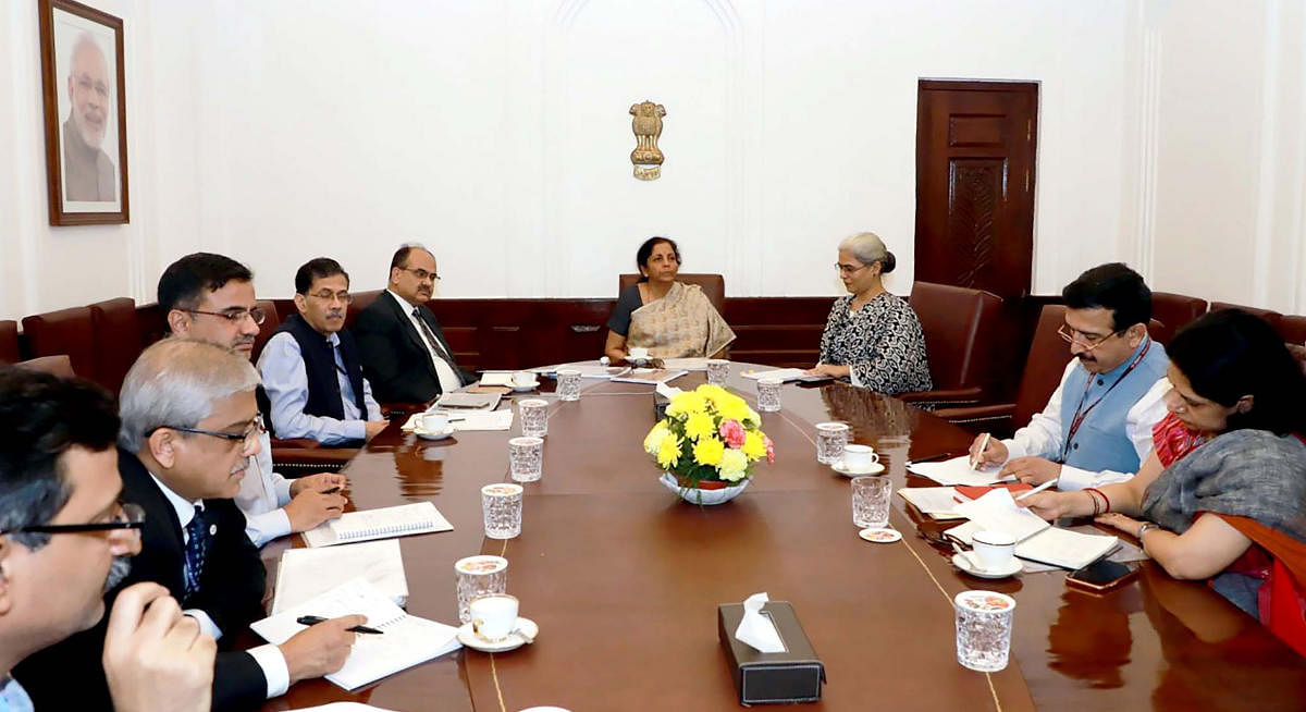 Union Minister for Finance and Corporate Affairs Nirmala Sitharaman chairs a meeting on simplification of GST forms and returns, in New Delhi, Saturday, Nov. 16, 2019. Revenue Secretary Ajay Bhushan Pandey is also seen. (PIB/PTI Photo)
