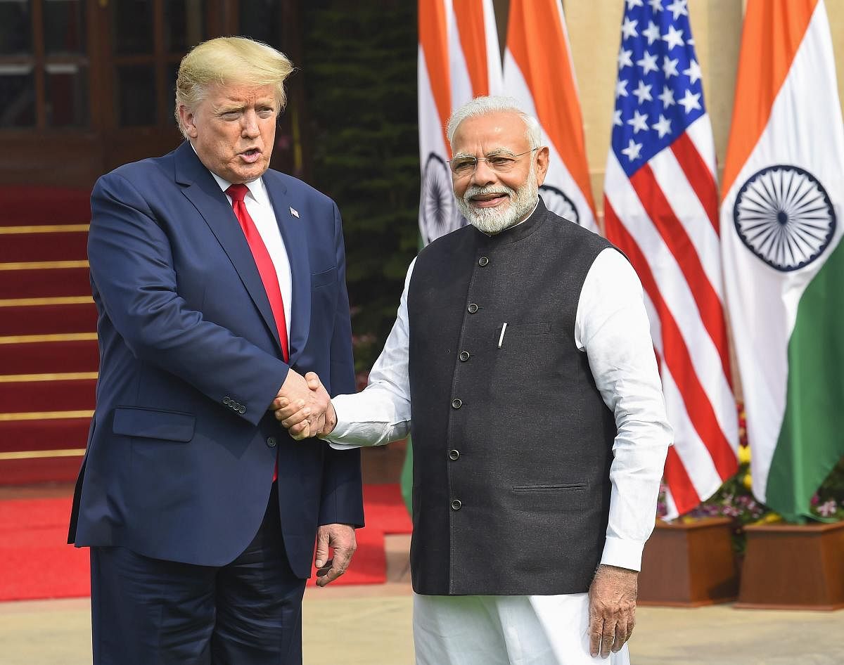 Prime Minister Narendra Modi shakes hands with US President Donald Trump prior to their meeting at Hyderabad House, in New Delhi, Tuesday, Feb. 25, 2020. (PTI Photo)