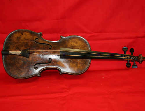 This is an undated handout image from auction house Henry Aldridge and Son made available on Friday Oct. 18, 2013 shows a violin believed to be the one played by Titanic bandmaster Wallace Hartley will now go on auction. It's a poignant scene familiar to anyone who has watched "Titanic" as the ship slides into the icy waters, musicians perform for the passengers, playing with stoic resolve until the final hour. None of the musicians survived in the 1912 disaster in the North Atlantic. The auction house, which specializes in Titanic memorabilia, expects the violin to fetch more than 200,000 pounds (US$323,300) when it goes on sale Saturday Oct 19, 2013. AP Photo