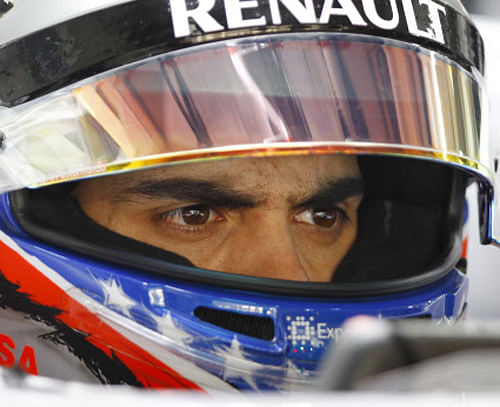 Williams driver Pastor Maldonado of Venezuela waits in his car during the second practice session at the Indian Formula One Grand Prix at the Buddh International Circuit in Noida, India, Friday, Oct. 25, 2013. AP Photo.