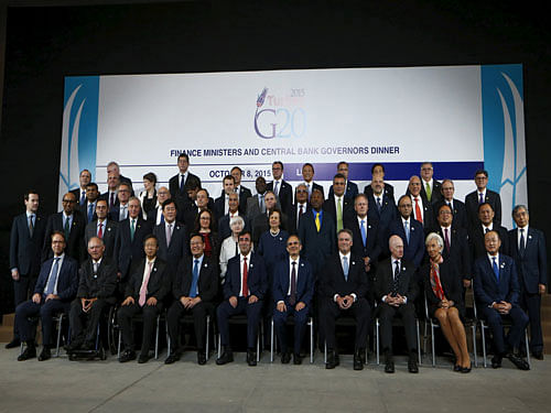 Finance Ministers and head of national banks members of the G-20 pose with IMF Managing Director Lagarde, World Bank President Jim and global policymakers for a group picture at the 2015 IMF/World Bank Annual Meetings in Lima. Reuters Photo