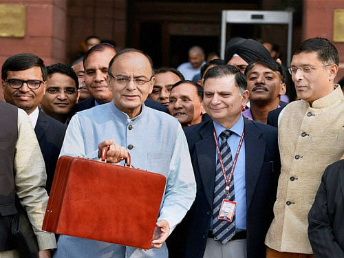 Finance Minister Arun Jaitley along with his budget team leave from North Block to meet President before presenting the Union Budget 2016-17, in New Delhi on Monday. PTI Photo