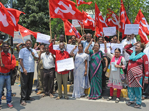 Members of Communist Party of India (Marxist) staging protest against new property tax, in front of BBMP office, N R Circle in Bengaluru on Monday, 02 May 2016. DH photo