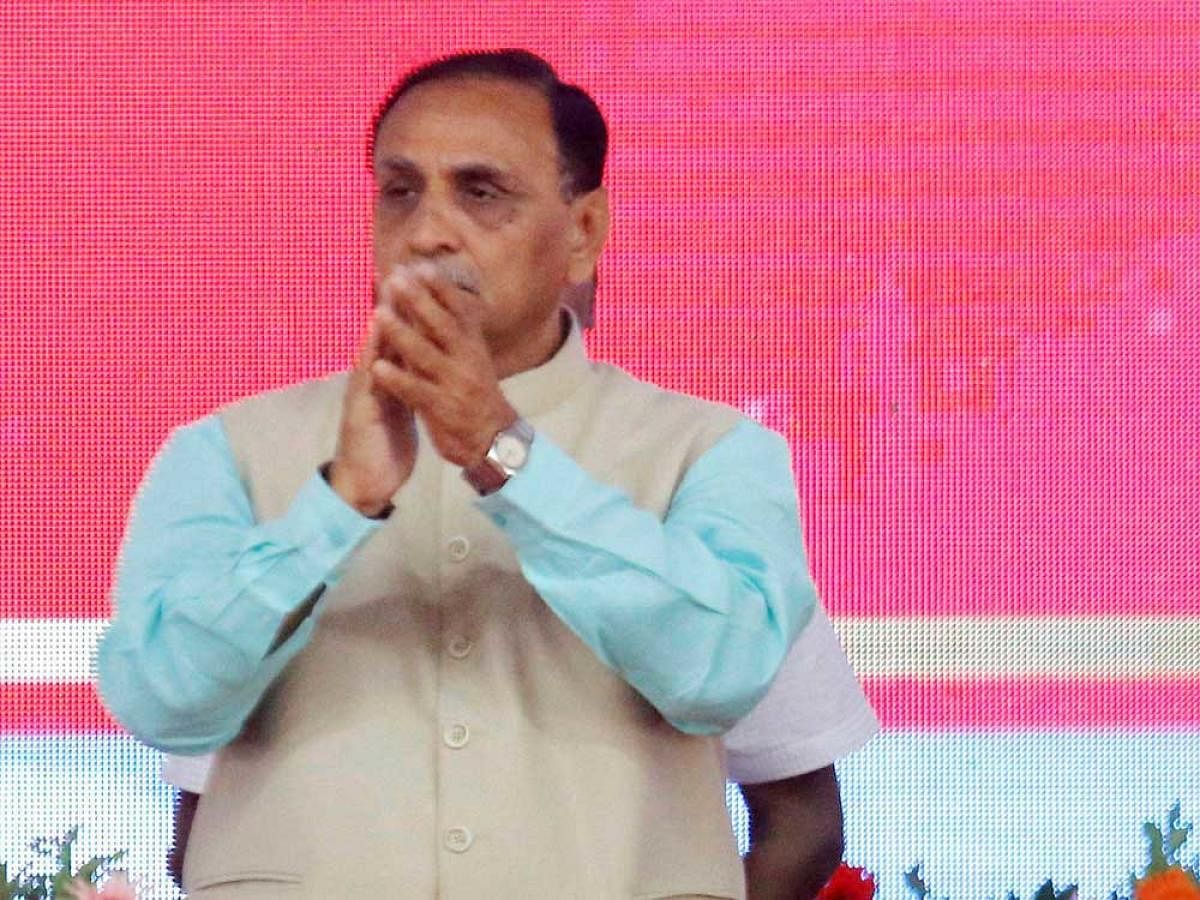 Vijaybhai Rupani, CM of Gujarat, is BJP's candidate from West Rajkot, while the deputy CM will contest from Mahesana. PTI file photo.