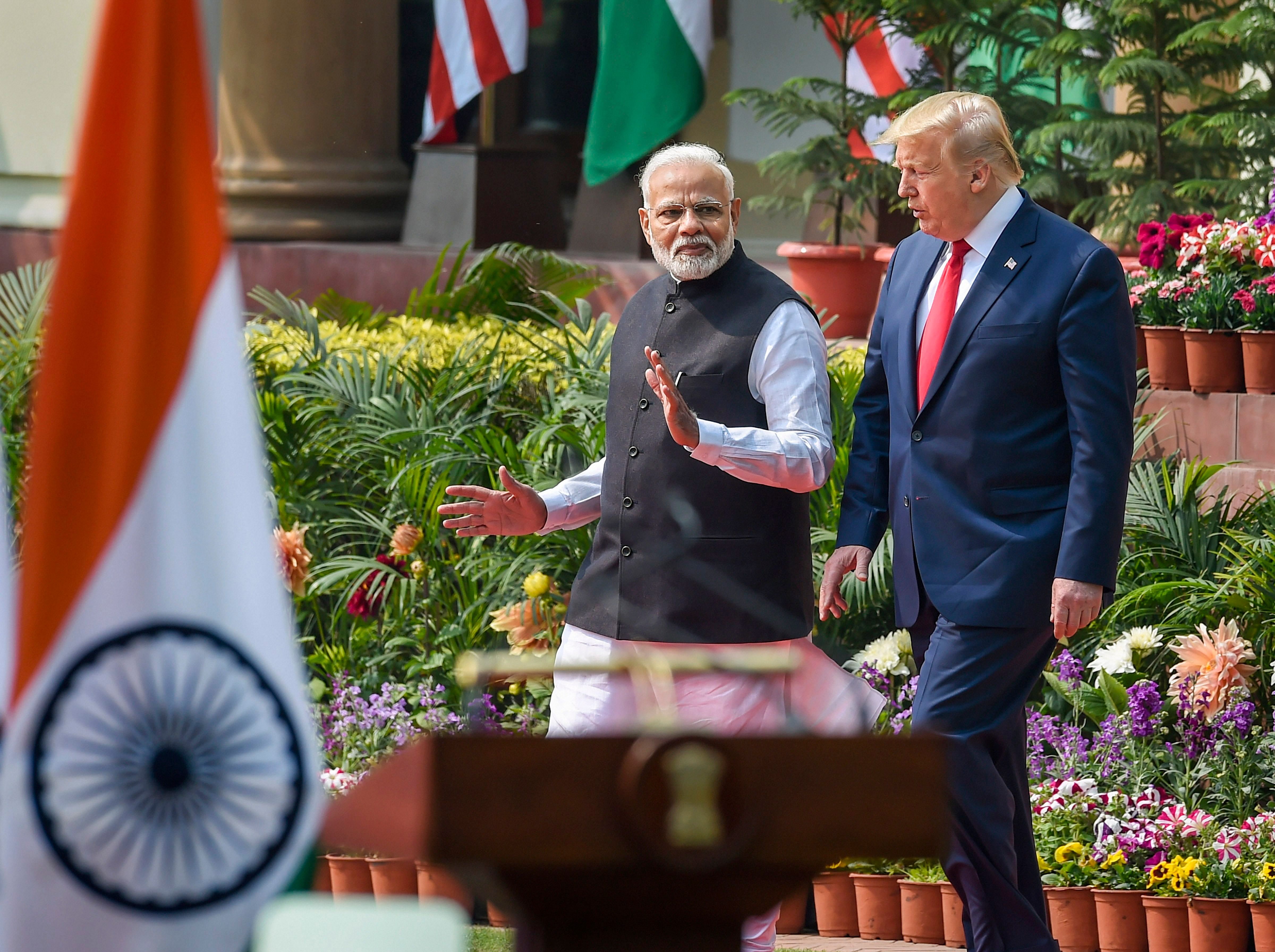 Prime Minister Narendra Modi (L) and US President Donald Trump arrive to address their joint press statement, at the Hyderabad House in New Delhi. (PTI Photo)