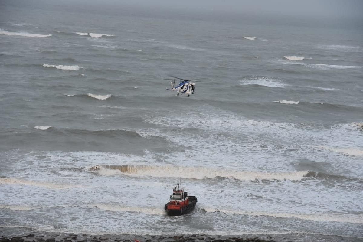 Indian Coast Guard rescuing one of the seven fishermen caught onboard a tugboat from mid-sea off Porbandar coast in Gujarat on Wednesday.