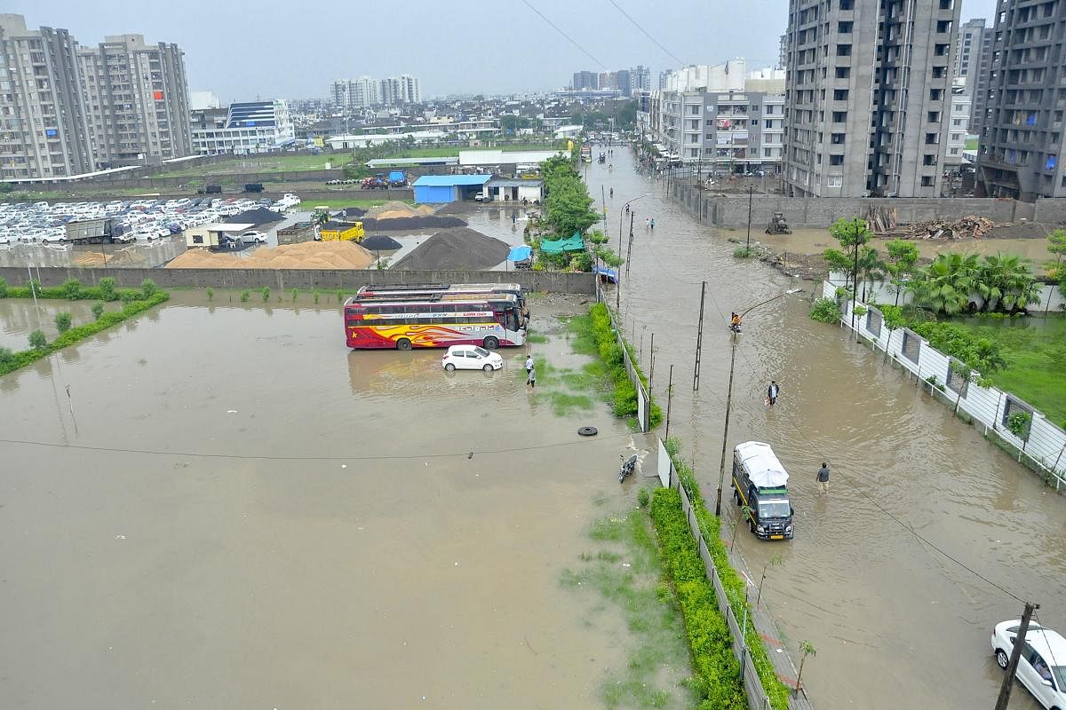 A flooded locality after heavy rain in Surat on Monday. PTI