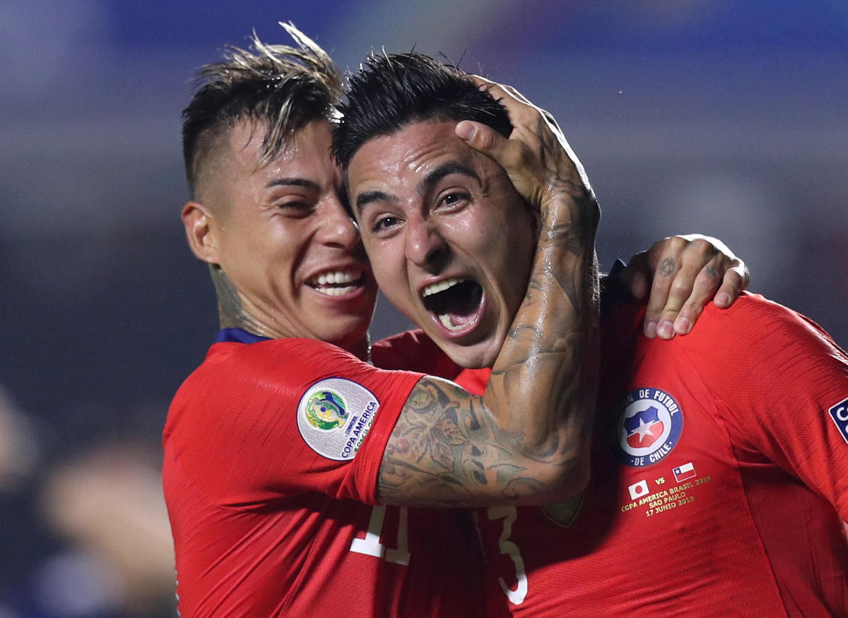 Chile's Erick Pulgar celebrates scoring their first goal with Eduardo Vargas. (REUTERS)