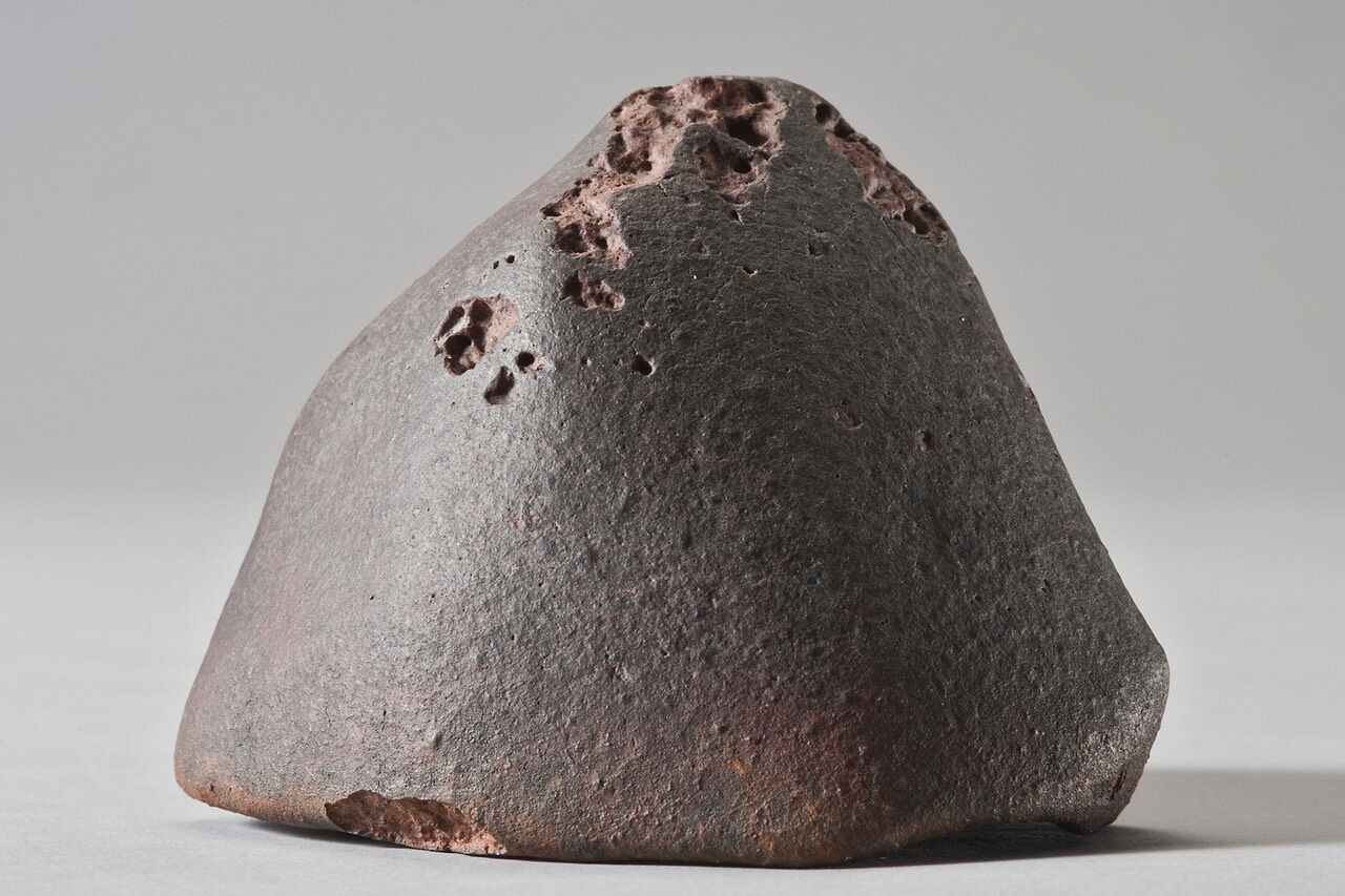 The L6 ordinary chondrite El Médano 128, a 556 g meteorite recovered in the Atacama Desert. Photo courtesy CCJ-CNRS, P. Groscaux. Credit: Photo courtesy CCJ-CNRS, P. Groscaux.