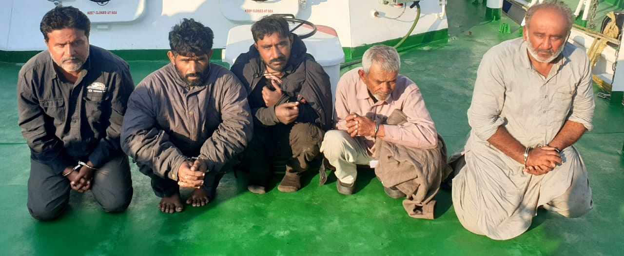 A team of officers involved in the operation intercepted a boat on the International maritime board at Jakhau in Kutch. (DH photo)