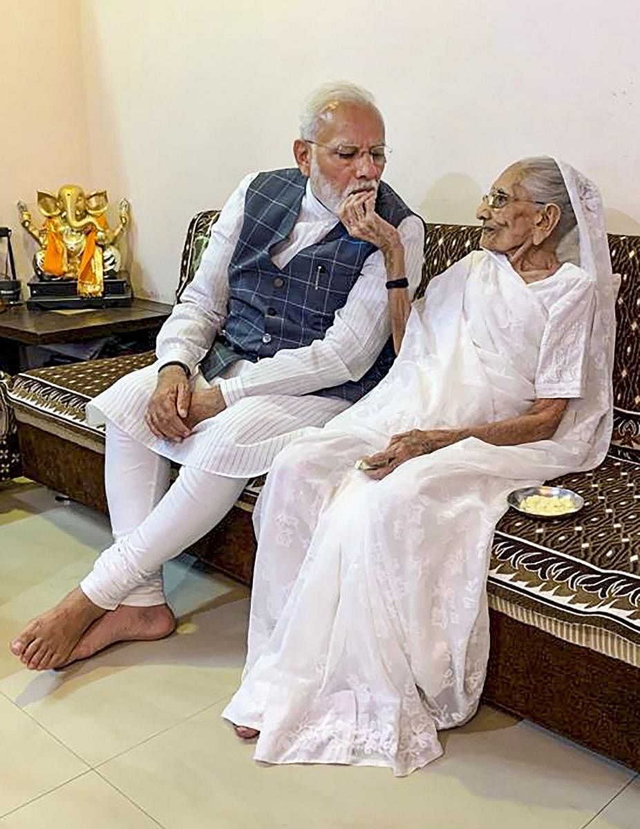 Prime Minister Narendra Modi meets his mother Heeraben Modi, in Gandhinagar, Wednesday, Oct. 30, 2019. (PTI Photo)