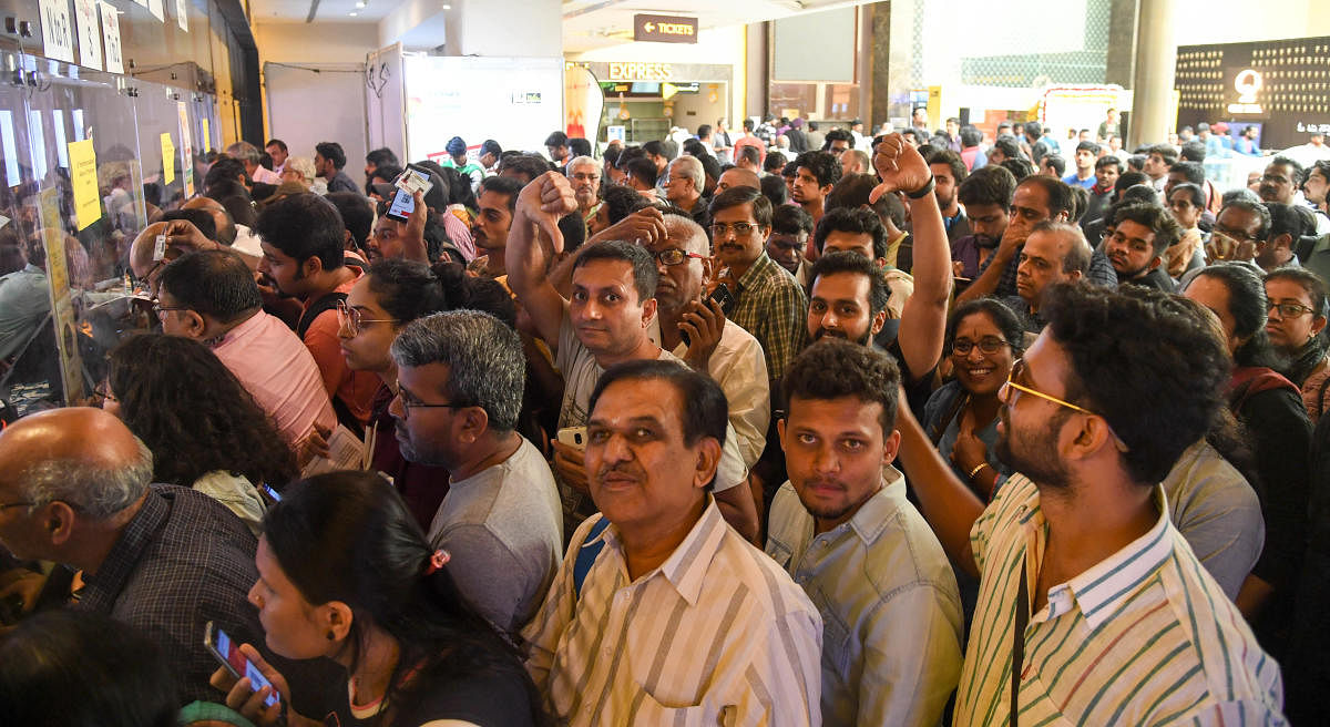 People shows thumbs down…. crowd for the passes at the ticket counters on first day of BIFFES at Orion mall in Bengaluru on Thursday. (Photo/ B H Shivakumar)