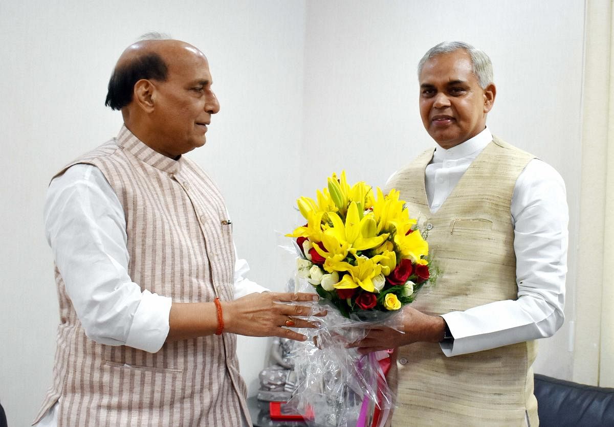 Defence Minister Rajnath Singh being greeted by designate Governor of Gujarat Acharya Devvrat during a meeting (PTI Photo)