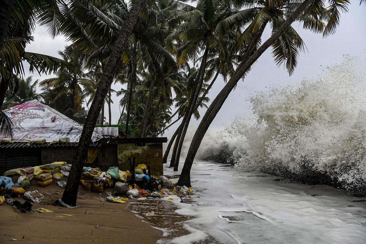 Sea waves crash close to a habitation in Chellanam area of Kochi. (PTI Photo)