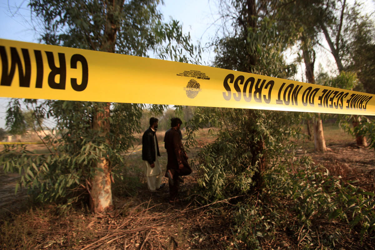 Men walk near a cordoned area, after remains of a teenager, who had been missing for two days, were found in the lions' enclosure at a safari park in Lahore, Pakistan February 26, 2020. (Reuters Photo)