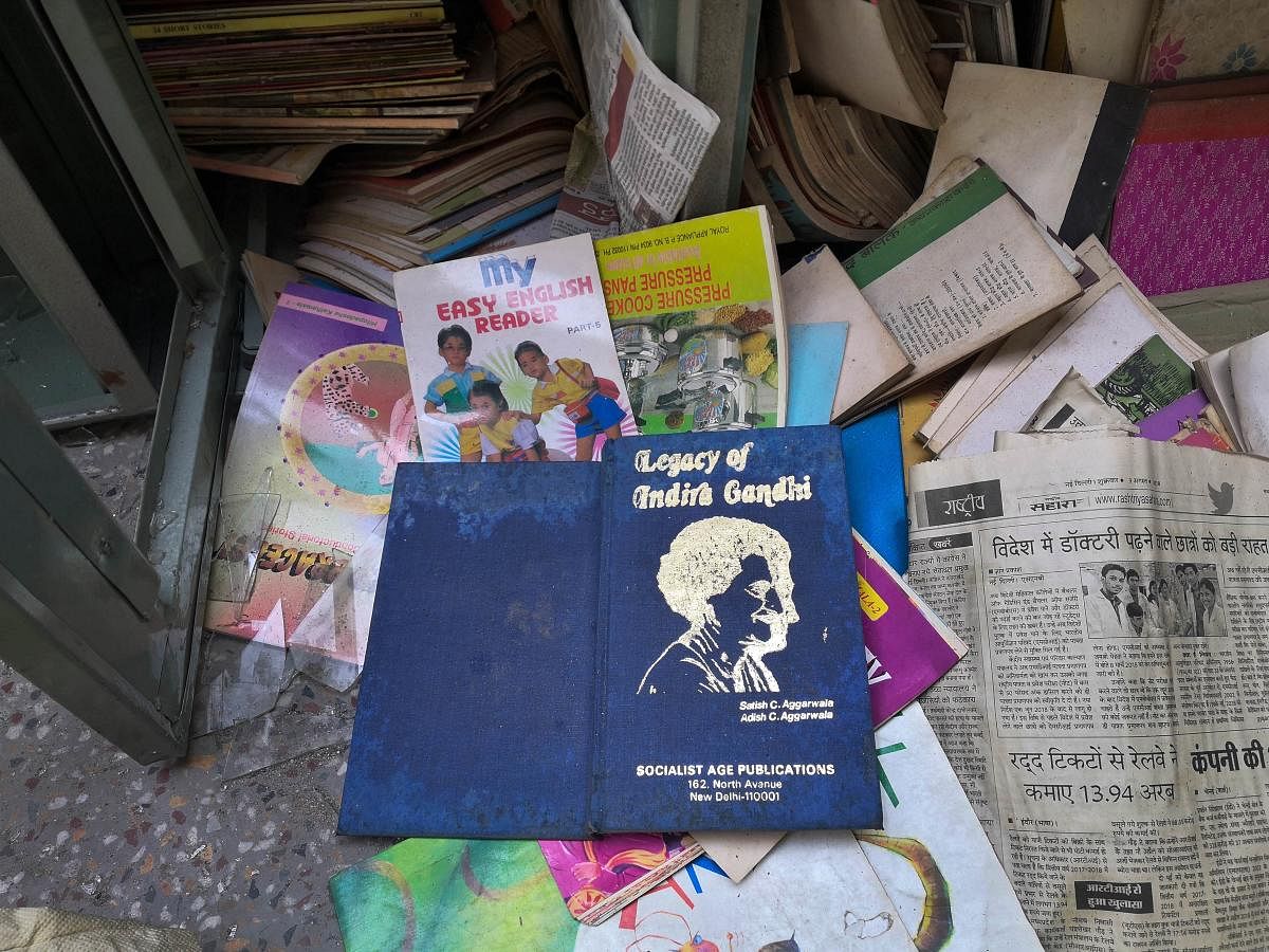 Books lying on a floor of library, following clashes over the new citizenship law, at Arun Modern School, in Brijpuri area of Northeast Delhi, Thursday, Feb. 27, 2020. (PTI Photo)