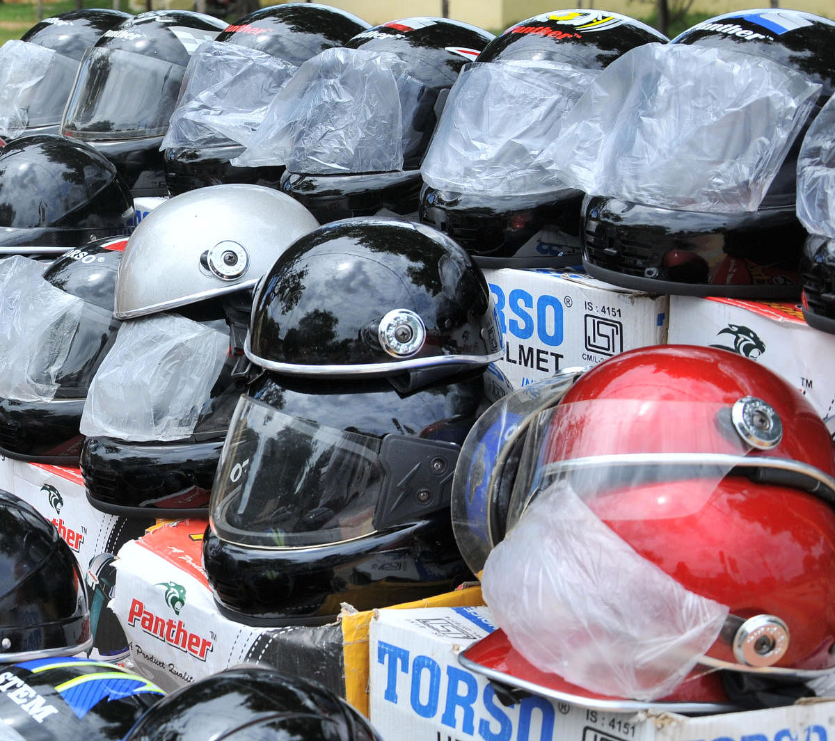 "However, helmets will be compulsory on state highways, nationals highways and roads falling under panchayat limits," said state transport minister R C Faldu. DH Photo