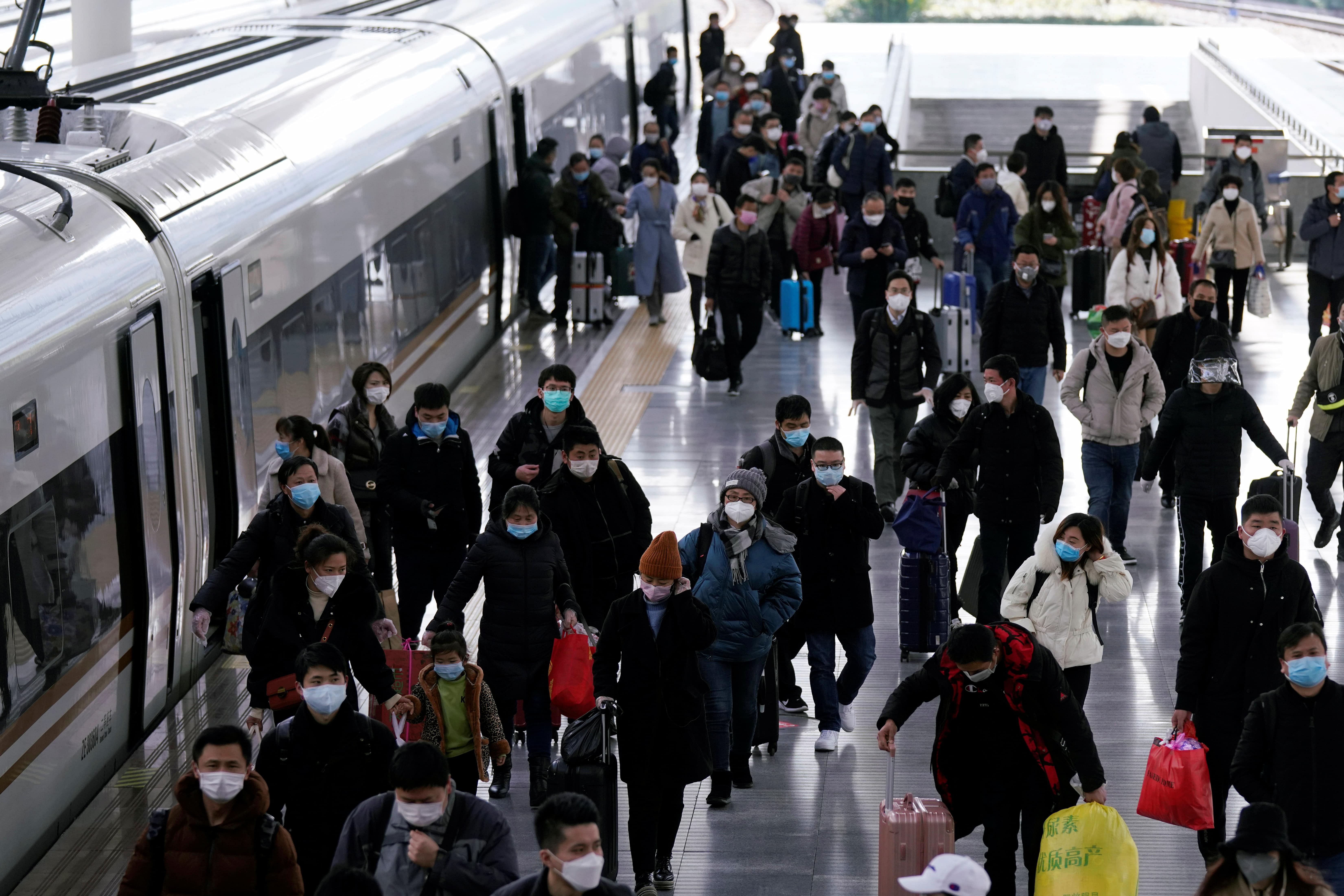 Passengers wearing masks are seen arrival at the Shanghai railway station in Shanghai, China, as the country is hit by an outbreak of a new coronavirus, February 27, 2020. (Credit: Reuters Photo)