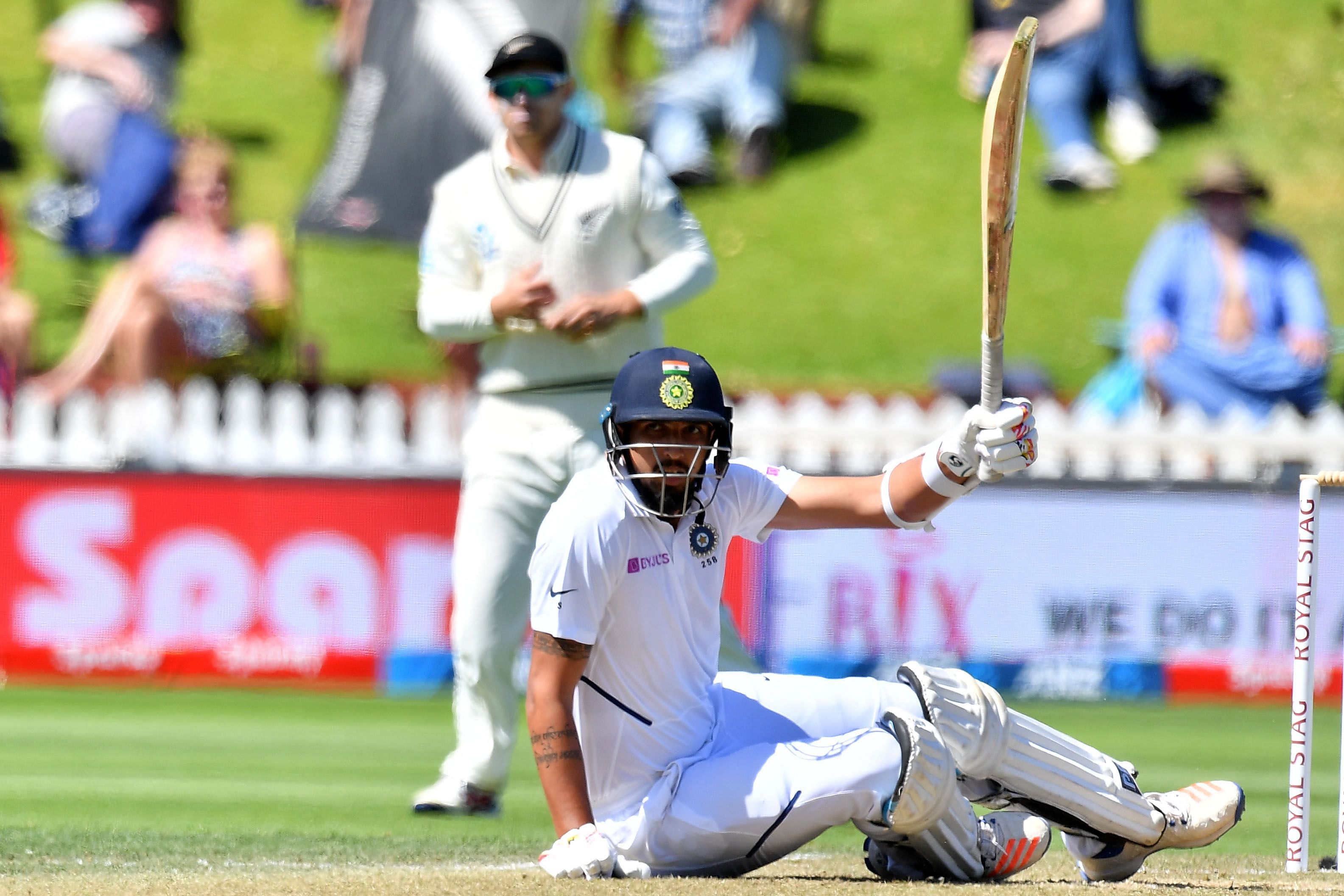 India's Ishant Sharma is knocked off his feet by the ball as he plays a shot during day four of the first Test cricket match between New Zealand and India at the Basin Reserve in Wellington. (AFP Photo)