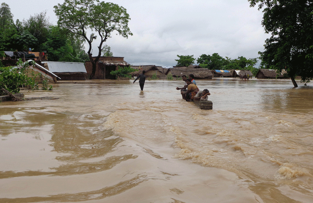 The toll in Uttar Pradesh floods today mounted to 41, with reports of 13 more deaths in the state where over 1,000 villages were affected by the flood waters of several rivers flowing above the danger mark. PTI photo