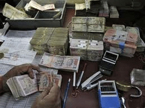 Undisclosed income to the tune of Rs 90,000 crore was detected during 2013-14 in various searches and surveys conducted by the Income Tax department, a top official from the Central Board of Direct Taxes (CBDT) said here today. Reuters file photo. For representation purpose