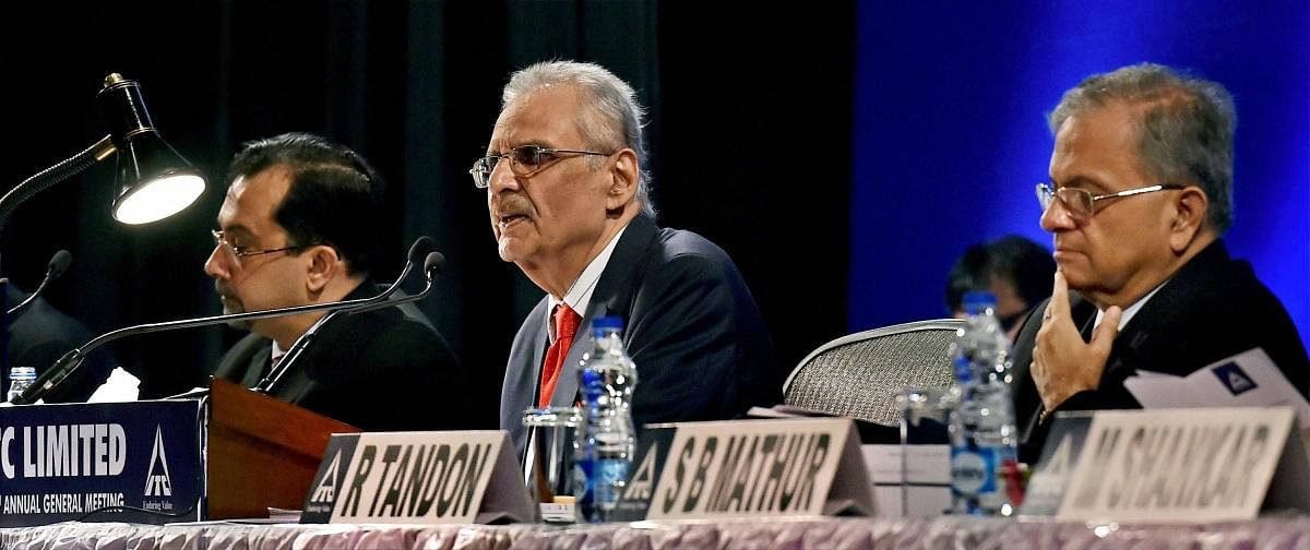 Yogesh Chandra Deveshwar(C), Chairman and Non-Executive Director of ITC along with Sanjiv Puri(L), CEO and Executive Director and Rajiv Tandon(R), Executive Director and Chief Financial officer addresses company shareholders during 106th AGM in Kolkata on Friday.