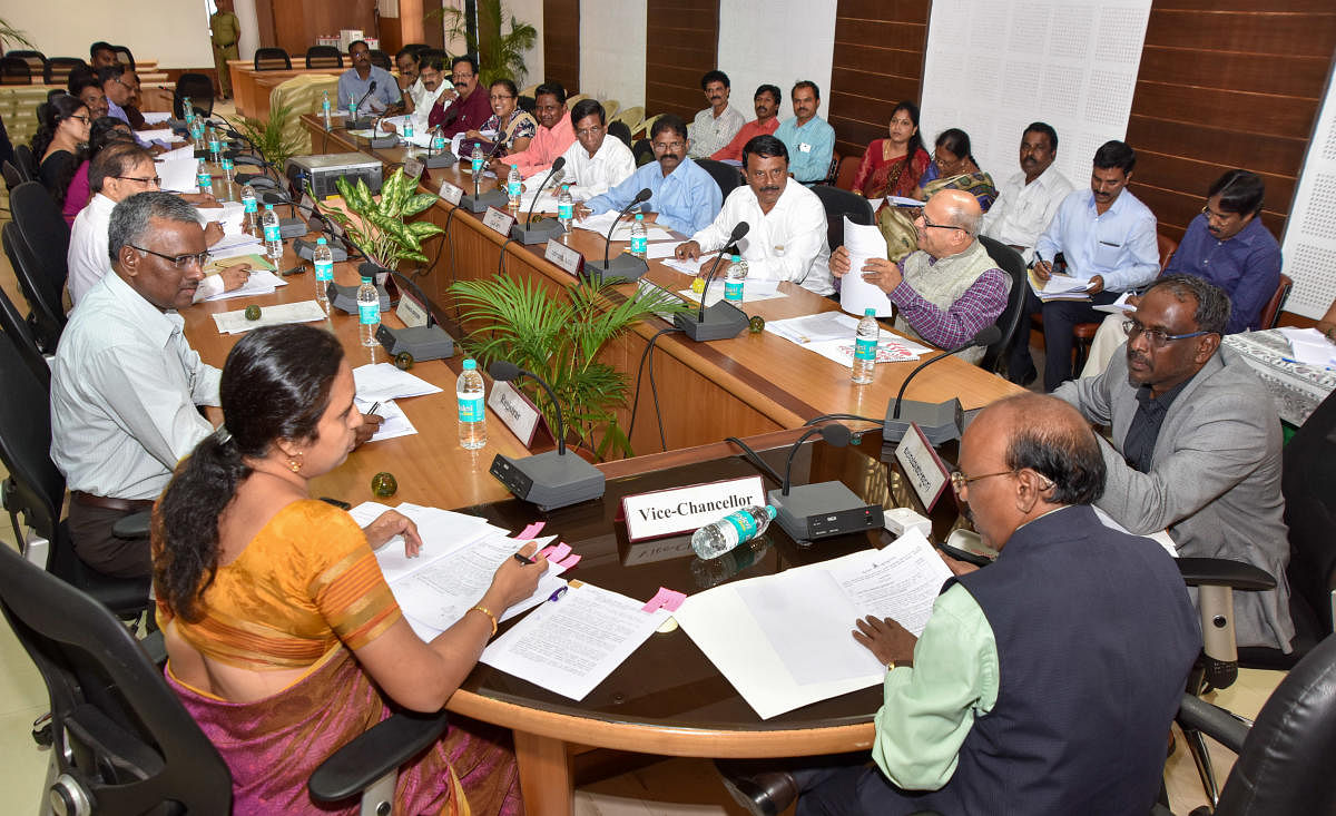 University of Mysore in-charge VC Dayananda Mane addresses Academic Council members in a meeting at Crawford Hall in Mysuru on Monday. Registrar D Bharati is seen.
