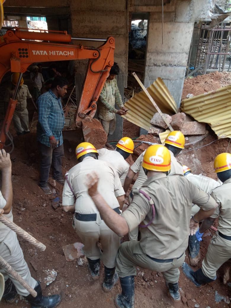 Two labourers were killed on the spot after mud caved on group of labourers at the site of a building under construction at 2 pm on Friday. (DH Photo)