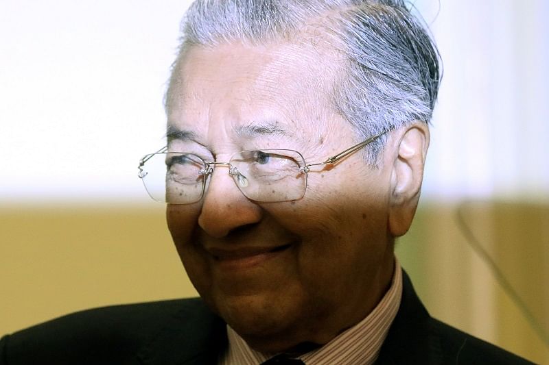 Malaysia's Interim Prime Minister Mahathir Mohamad reacts during a news conference in Putrajaya, Malaysia. (Reuters Photo)