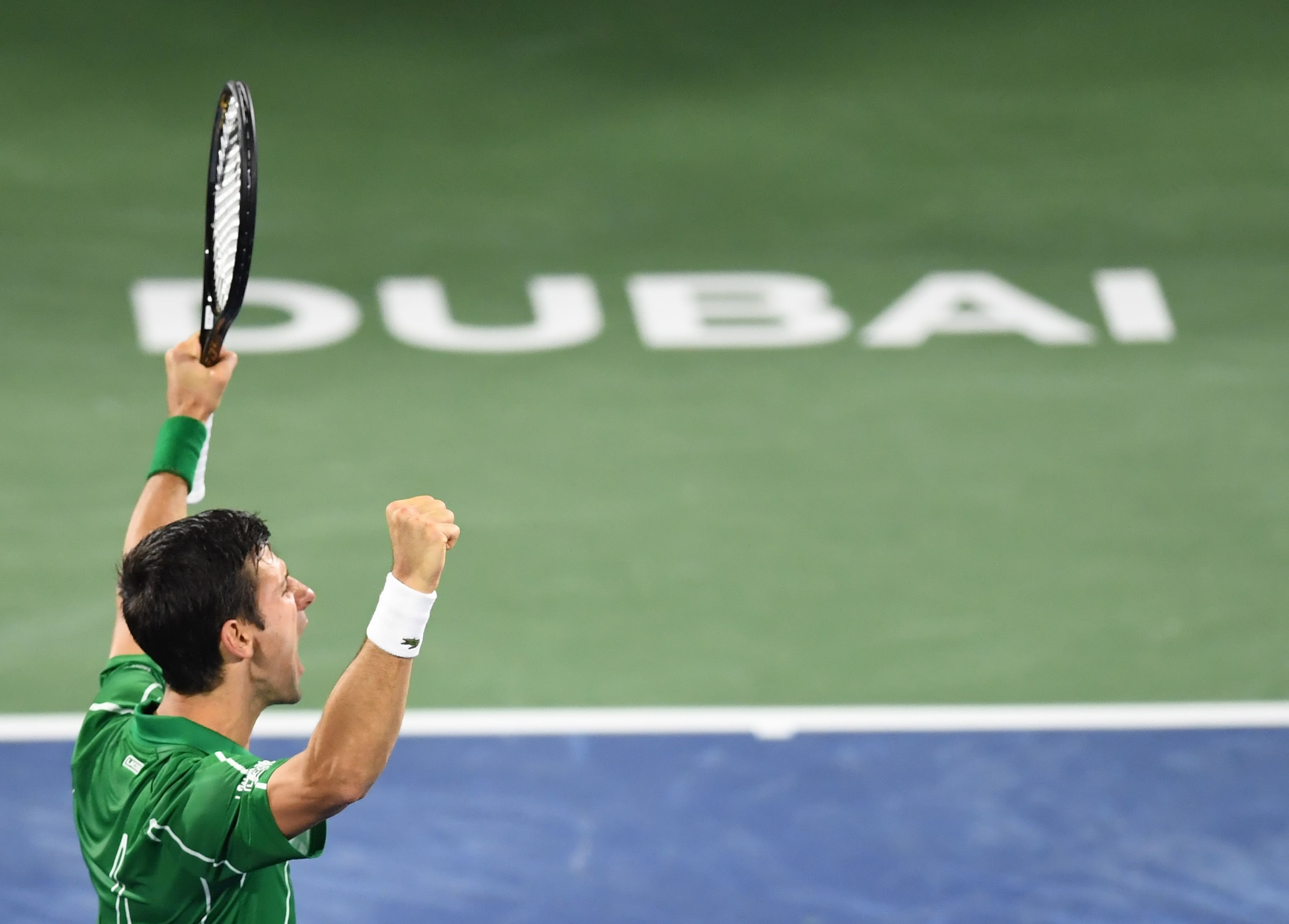 Novak Djokovic of Serbia reacts after winning his semifinal match against Gael Monfils of France during Dubai Duty Free Tennis Championship in the Gulf emirate of Dubai. (AFP Photo)