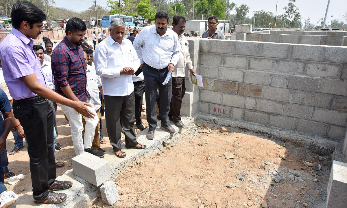 District In-charge Minister V Somanna inspects ongoing work atop the Chamundi Hill in Mysuru on Friday. Deputy Commissioner Abhiram G Sankar and MP Pratap Simha are seen. dh photo