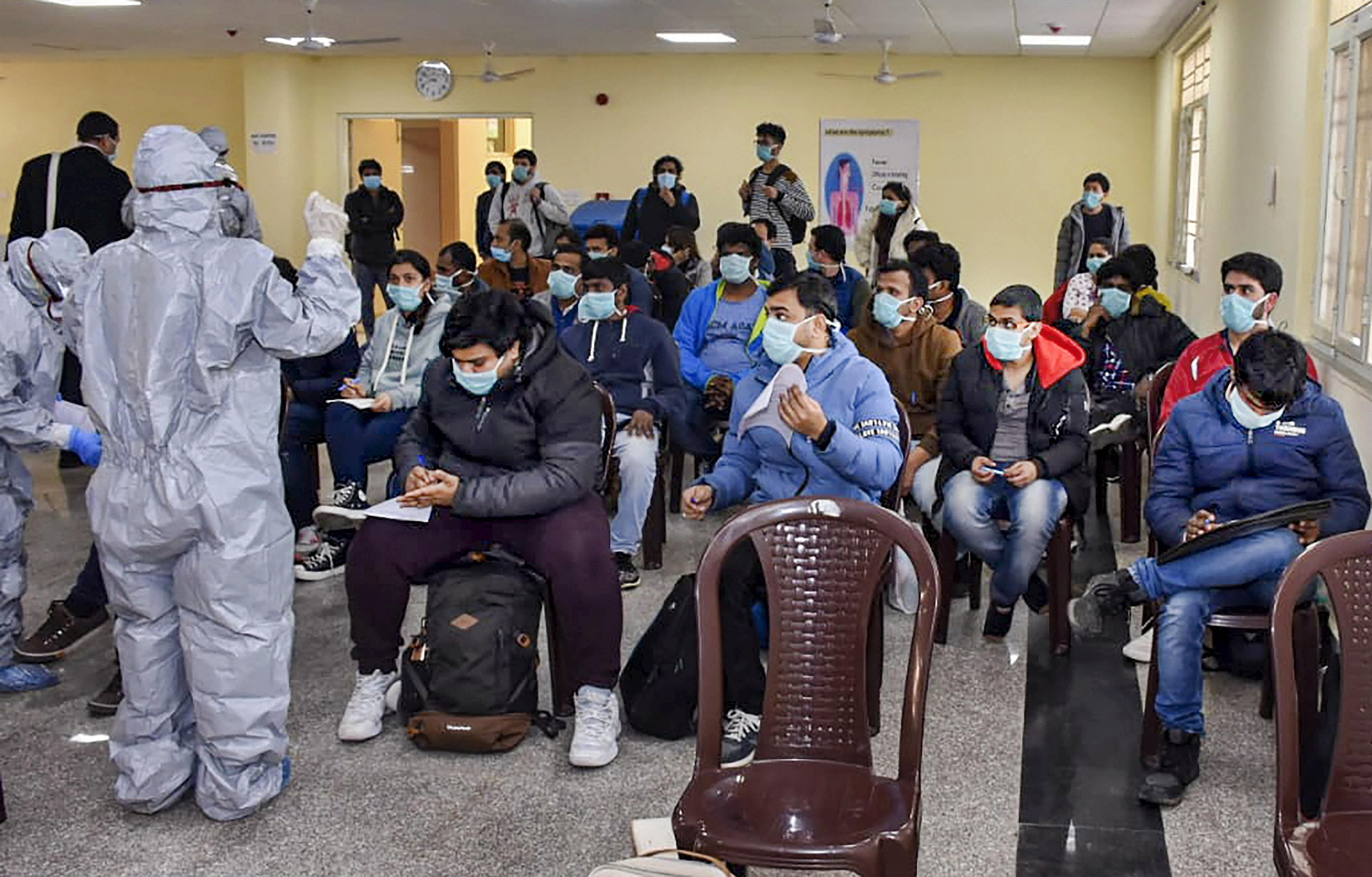 112 evacuees including 36 foreign nationals who were air-lifted from Wuhan, China following out-break of the deadly novel coronavirus, being quarantined by the ITBP Quarantine Facility. (Credit: PTI Photo)