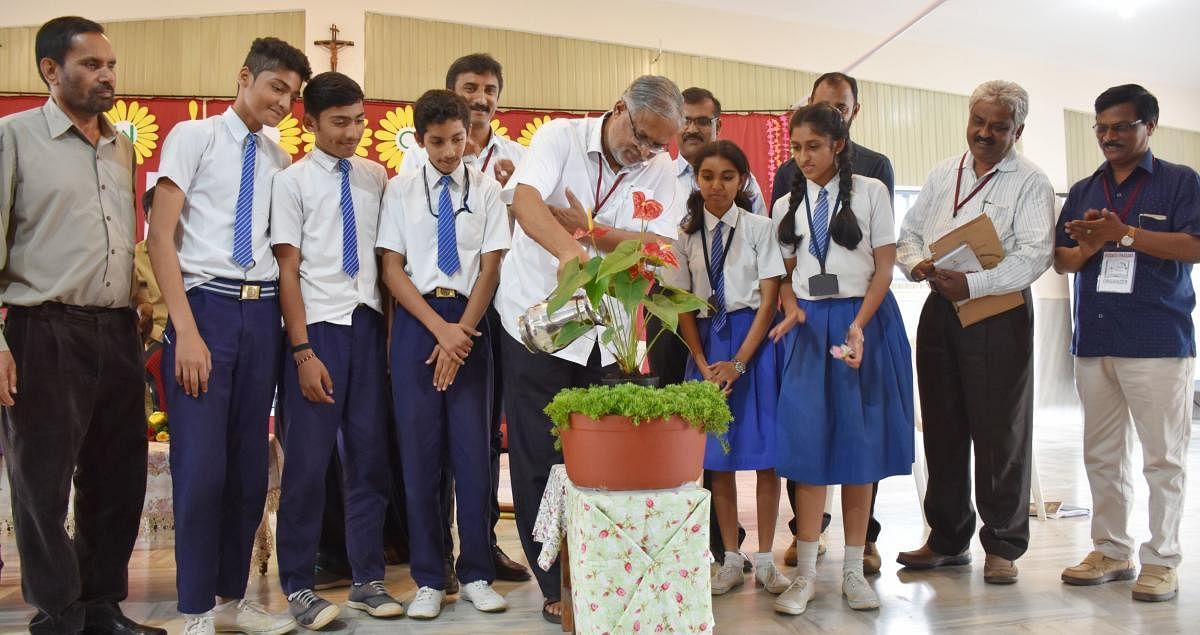 Minister for Primary and Secondary Education S Suresh Kumar inaugurates an interaction programme with students at St Joseph High School in Madikeri.