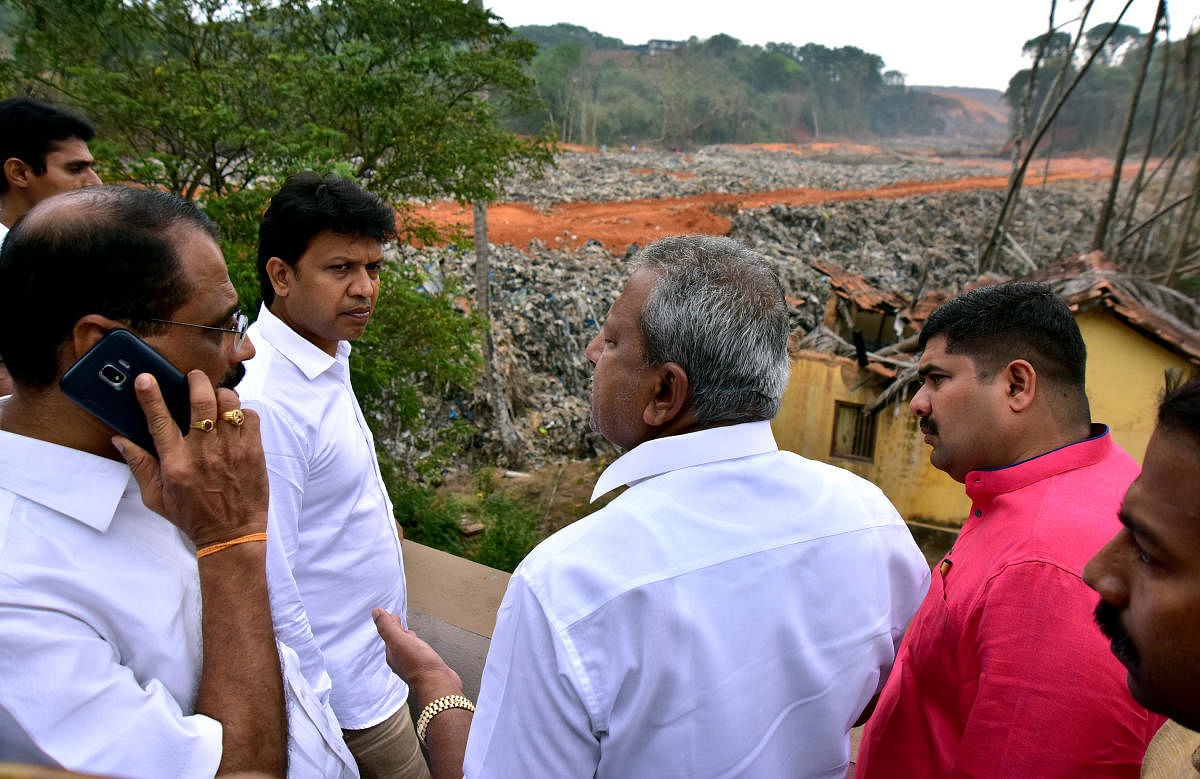 Urban Development Minister B A Basavaraj (Byrathi) took stock of the work to prevent the sliding of mounds of garbage, at Mandara near Pachhanady dumping yard on the city’s outskirts on Saturday.