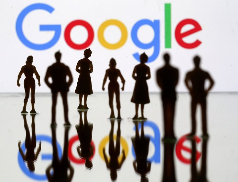 Small toy figures are seen in front of Google logo in this illustration. (Reuters Photo)