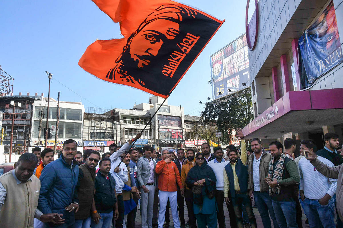 BJP workers raise slogans before viewing film 'Tanhaji' in Bhopal, Friday, Jan. 10, 2020. (PTI Photo)