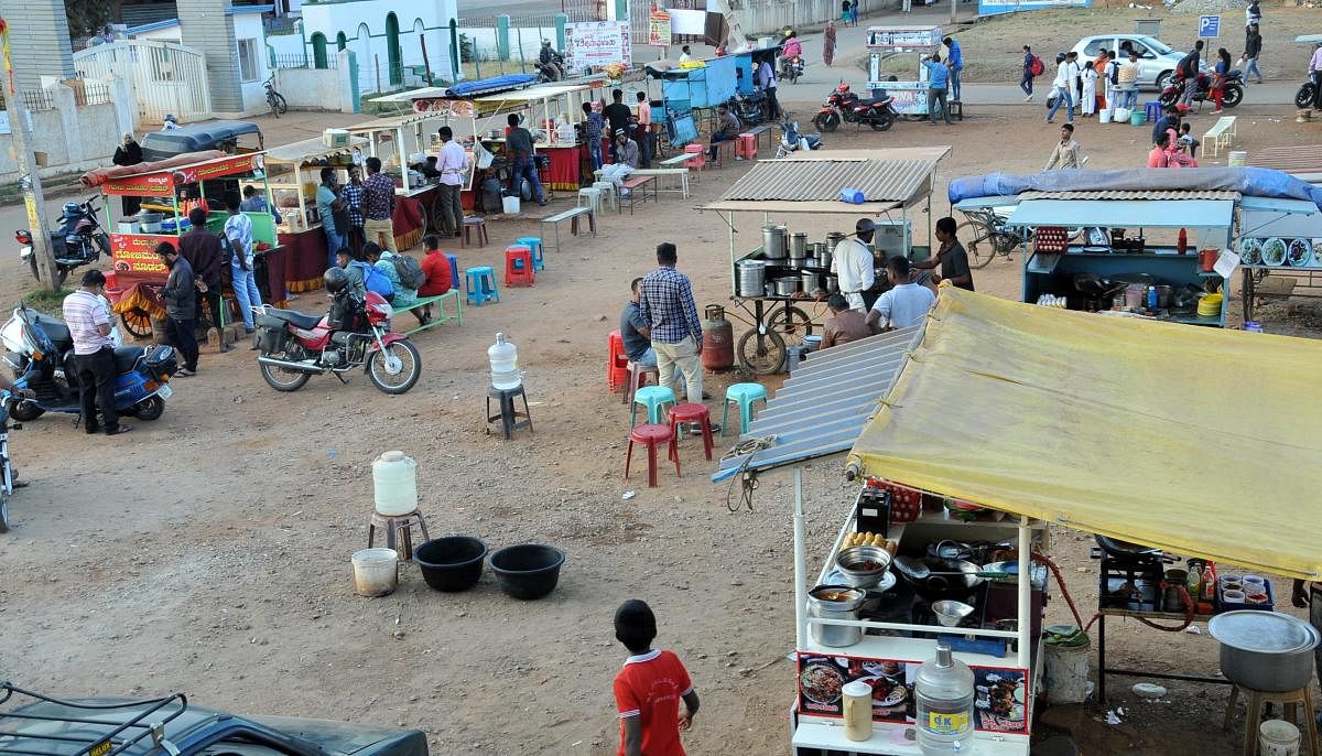 Pushcart vendors sell various items at Vijayanagara in Chikkamagaluru.