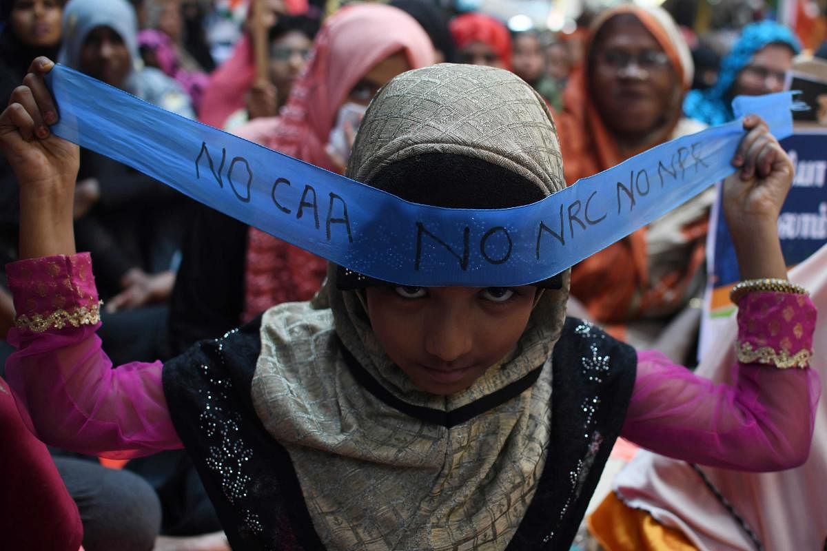 A young demonstrator wears a headband reading 'NO CAA/NRC/ NPR' during a protest organised by Tamilnadu Thowheed Jamath, following sectarian riots over India's new citizenship law, in Chennai on February 29, 2020. (AFP Photo)