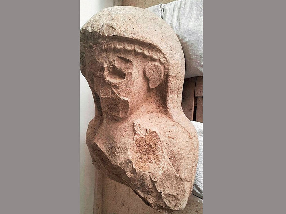 The statue, recovered from a citadel gate, shows intentional defacing of the face and chest, presumably a ritual work. Taiyant Archaeological Project photo.