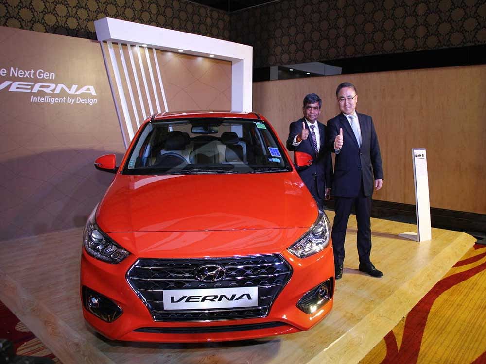 Rakesh Srivastava (left) and Sung Jong Ha unveil the Hyundai Next Gen Verna in Bengaluru on Wednesday.